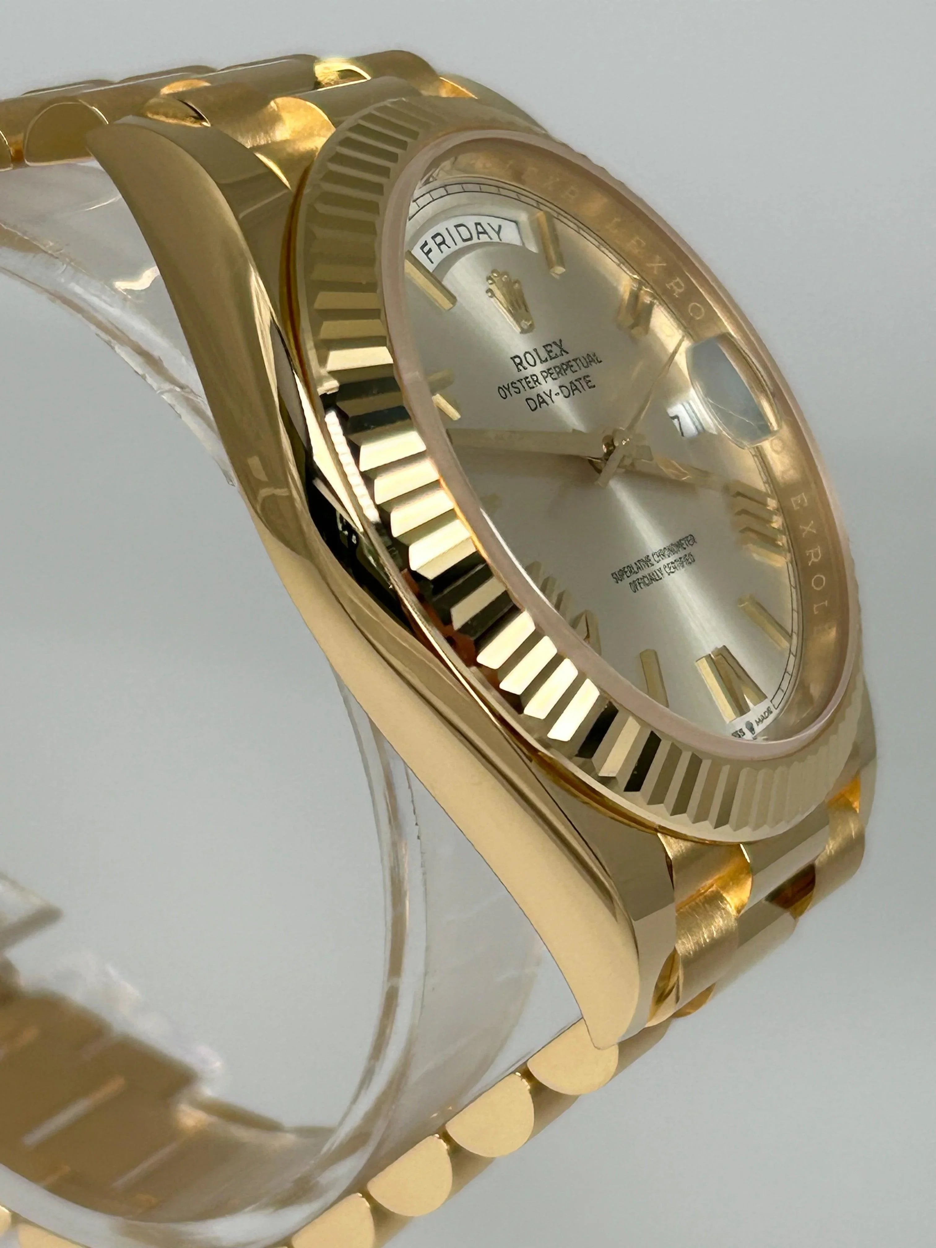 Rolex Day-Date 40 Silver Roman Yellow Gold 228238